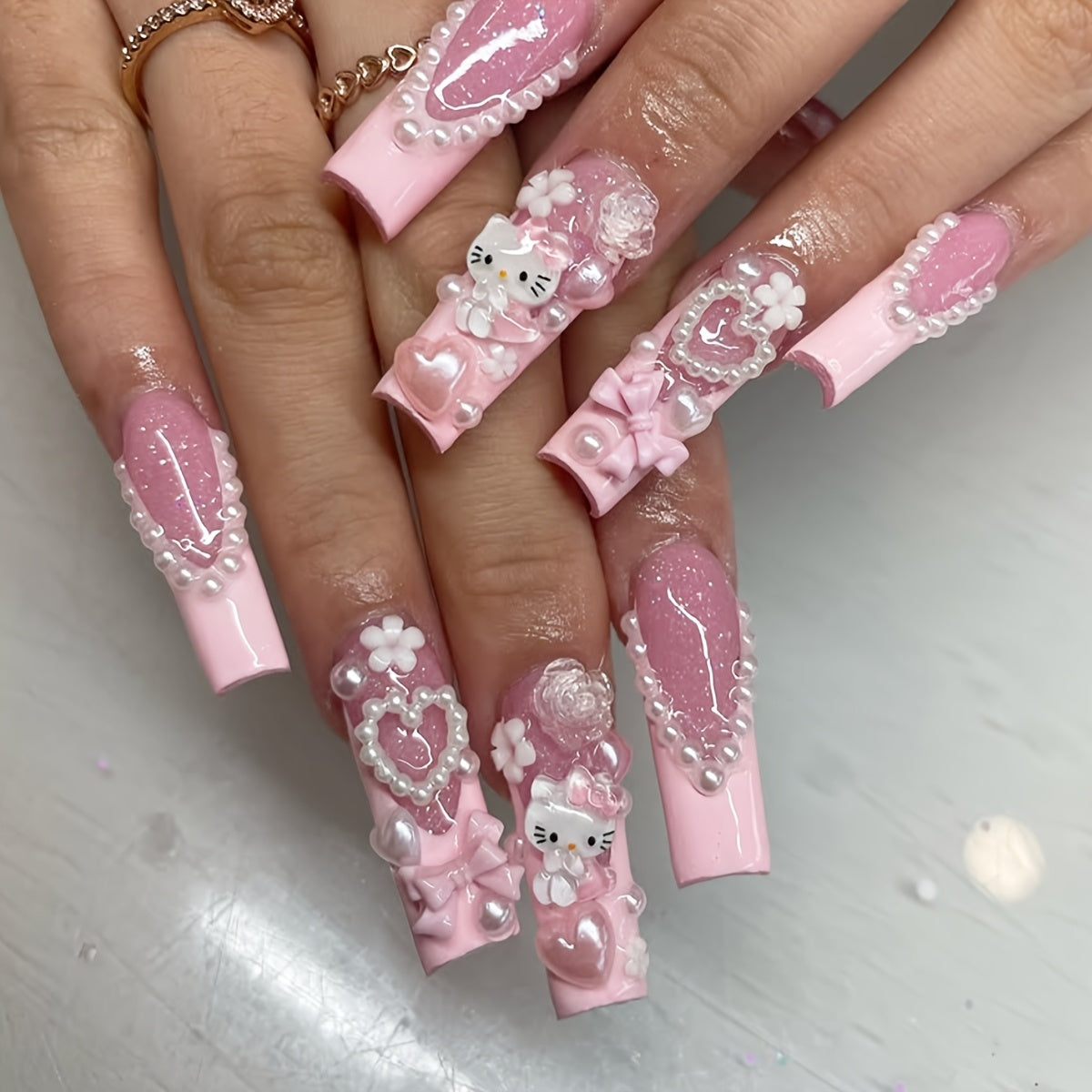 Get Glamorous with 24pcs Long Square Water Pipe Nails Y2K Three-Dimensional Cute Sanrio for hello kitty Cartoon Character Design, Heart Flower Pearl Bow Decoration, Pink French Edge Full Coverage False Nail Sticker Set for Wo