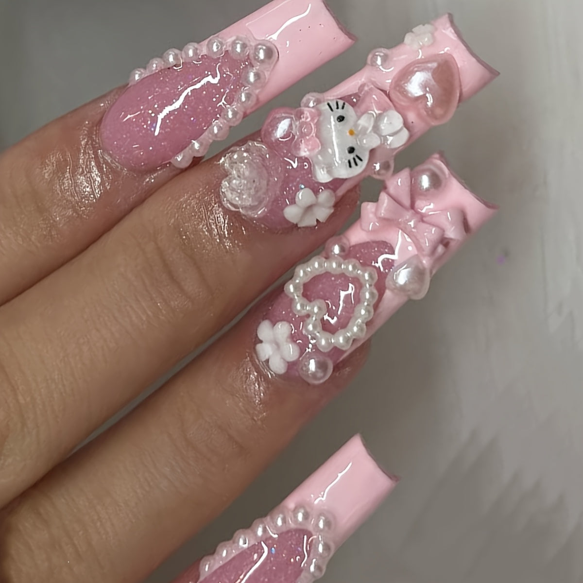 Get Glamorous with 24pcs Long Square Water Pipe Nails Y2K Three-Dimensional Cute Sanrio for hello kitty Cartoon Character Design, Heart Flower Pearl Bow Decoration, Pink French Edge Full Coverage False Nail Sticker Set for Wo